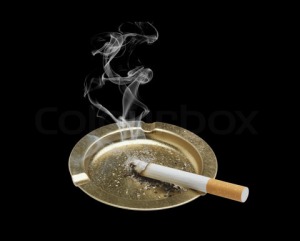 1622880-731491-cigarette-and-ashtray-isolated-on-black-background